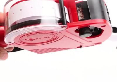 Loading a fresh label roll into an MX5500 price gun