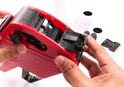 Fitting a fresh ink roller into a red MX5500 price gun