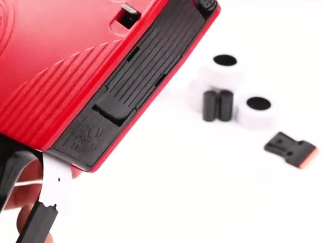 MX5500 price gun closed and loaded with the label strip coming out of the front