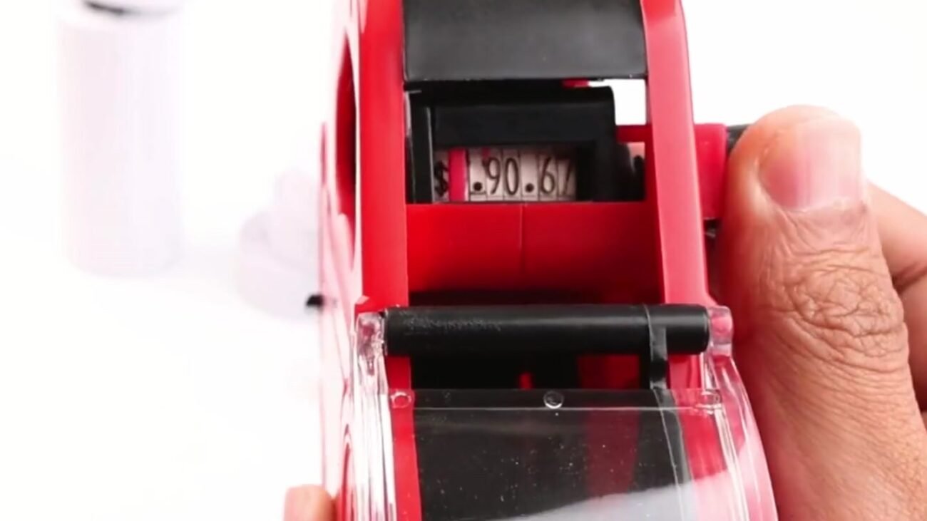 Setting the price dials on an MX5500, the first step in how to use a price gun