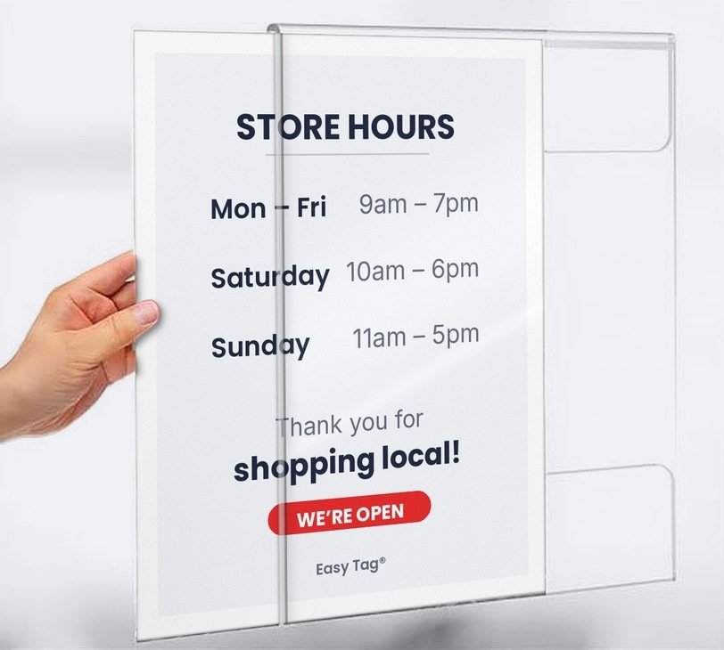 Easy Tag acrylic wall sign holder 8.5x11 with Store Hours sign being slid in by hand